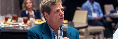 Attendee participating in conference session
